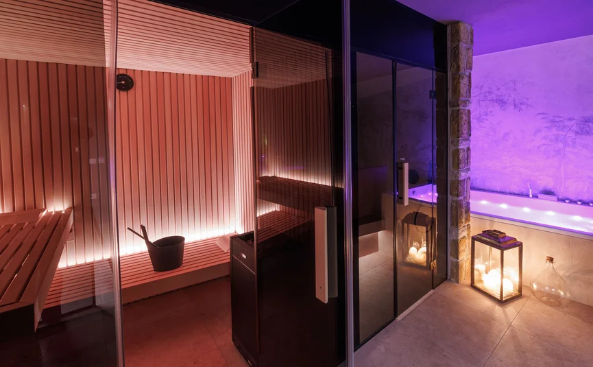 Hotel Vila Robida *** © Jaka Ivancic Sauna room with wooden interior and adjacent hot tub with candle lighting