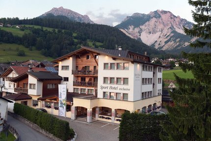 Sport hotel in the Alps with mountains in the background